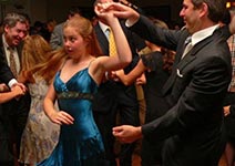 proud dad dancing with daughter